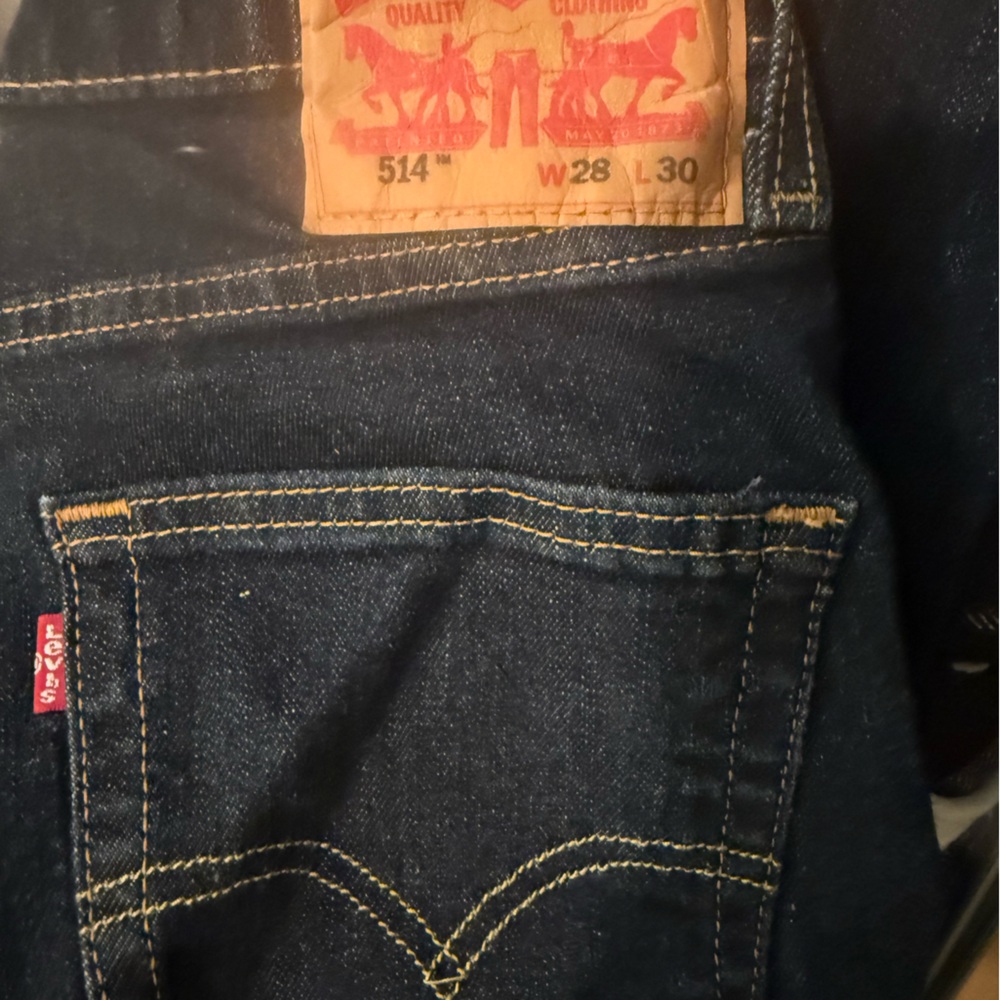 Gently Used Dark Blue Straight-Leg Jeans with Yellow Stitching